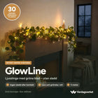 GlowLine ljusslinga med gröna blad över en spiselkrans – utan sladd